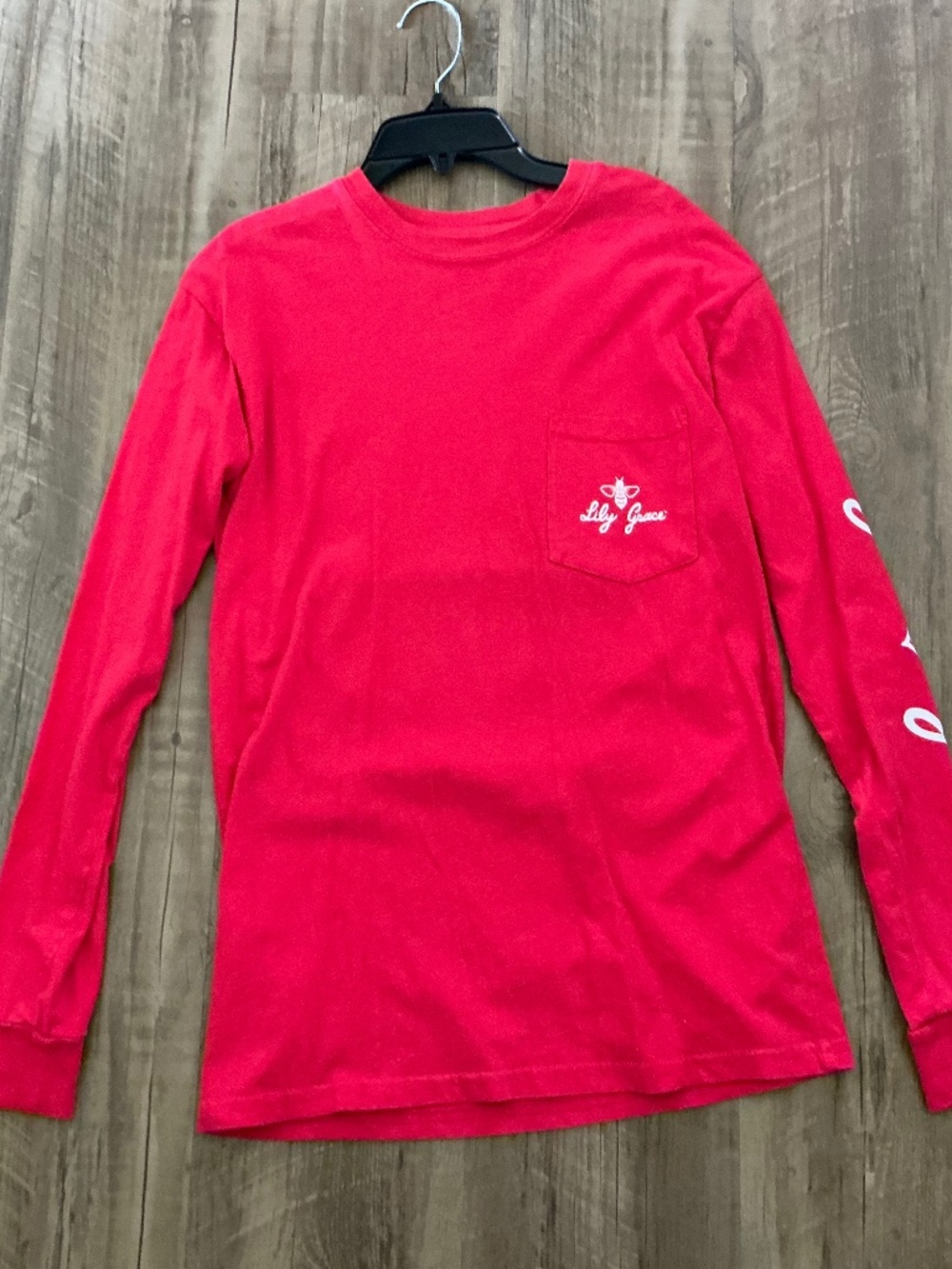Red long-sleeve pocket t-shirt by the Lily Grace, size S